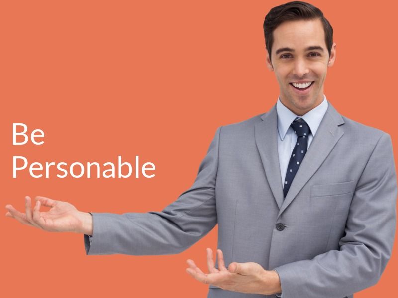 Man in a suit pointing to right with orange background - Tips on how to present yourself well in a real estate marketing video - Image