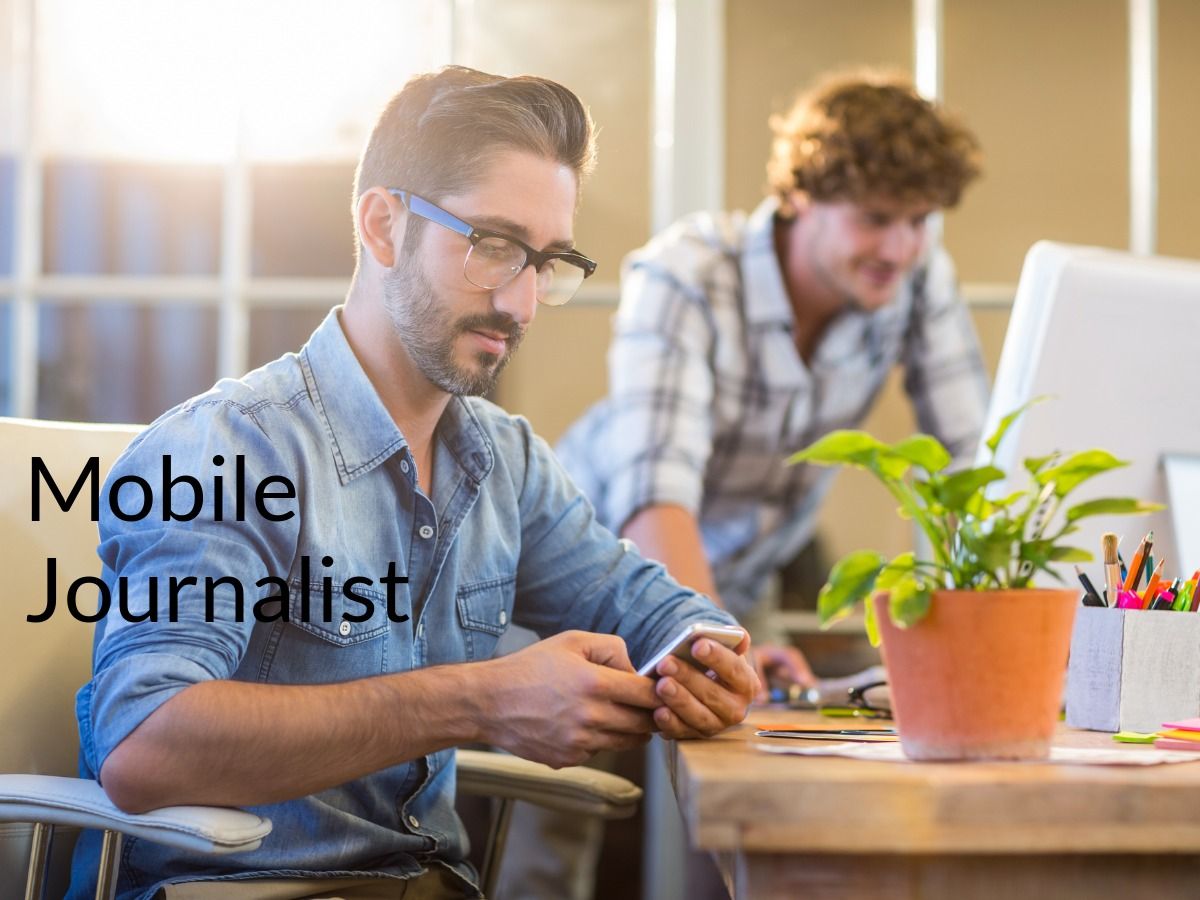 Mobile journalist working at desk - Tips for cutting down on professional videography costs when recording real estate marketing videos - Image