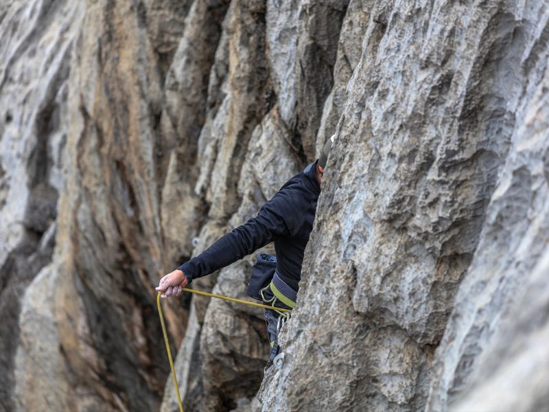 A male alpinist climbs the mountain - Climb a mountain for your birthday - Image