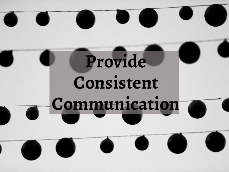 A black and white image of hanging decorations and the caption 'Provide consistent communication' - Personal branding for freelancers: Tips and tricks for your business - Image
