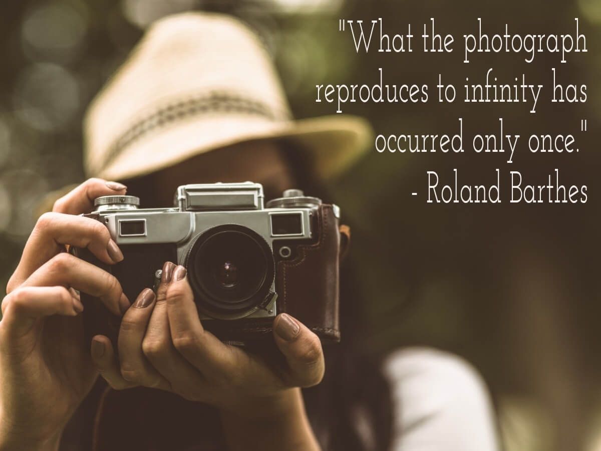 Young woman taking a photo in the woods with text 'what the photograph reproduces to infinity has occurred only once - Roland Barthes'' - Top 10 Passive Income Side Hustles: New Ideas to Boost Your Earnings - Image