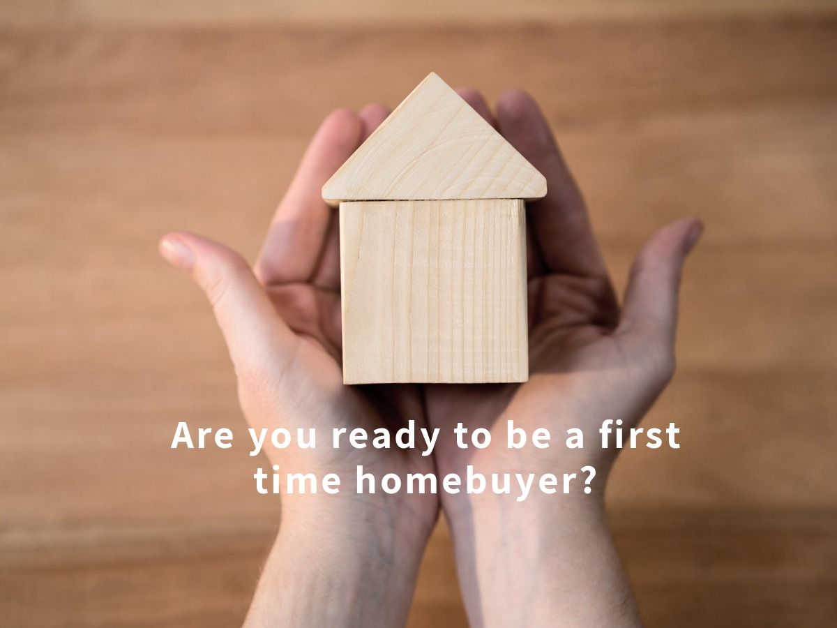 Person holding miniature house in hands and 'Are you ready to be a first homebuyer?' as a title20 proven real estate marketing ideas to help attract qualified buyers - Image
