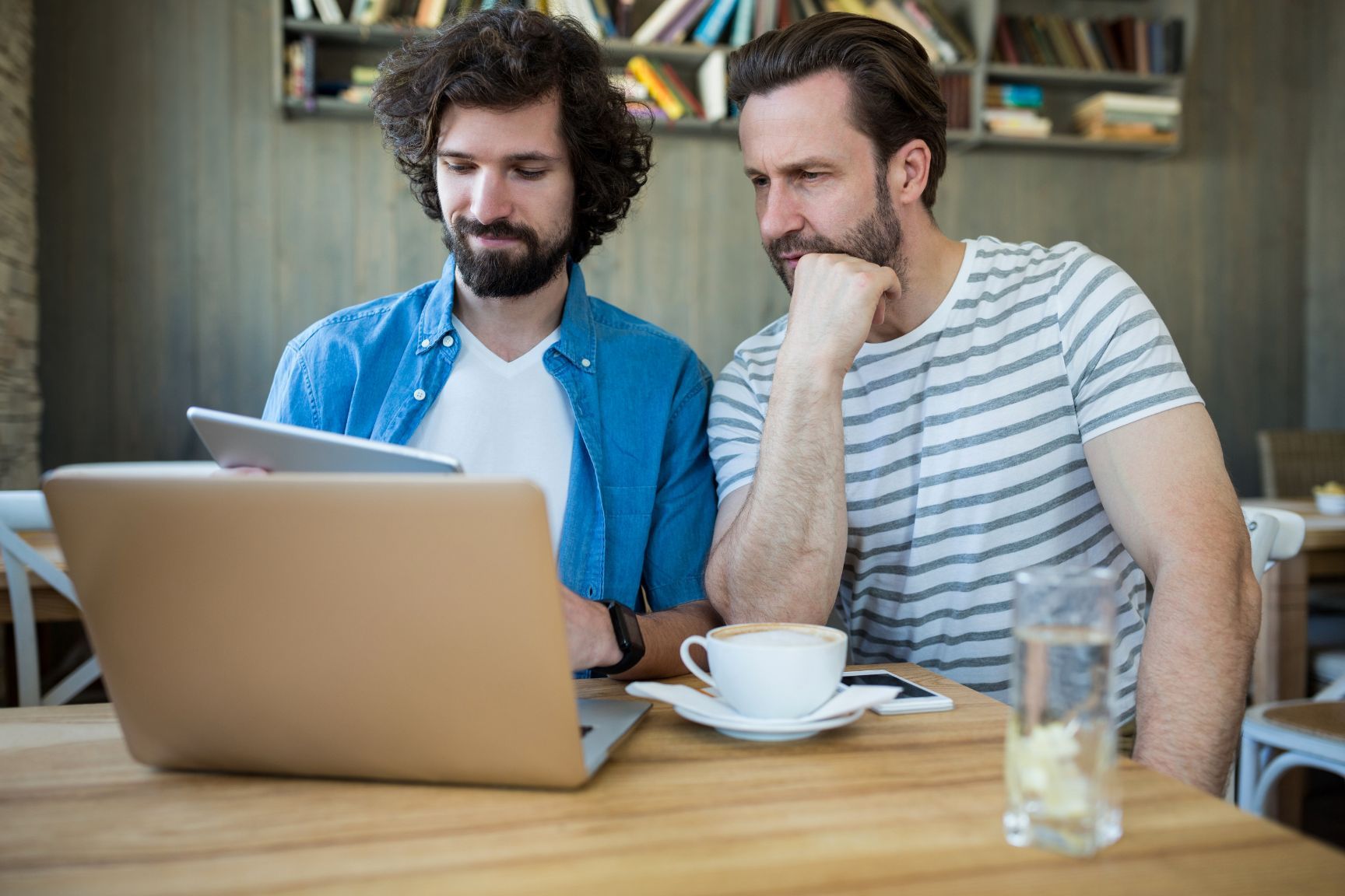 Two men at laptop - Twenty-eight helpful sales strategy ideas for boosting your business growth - Image