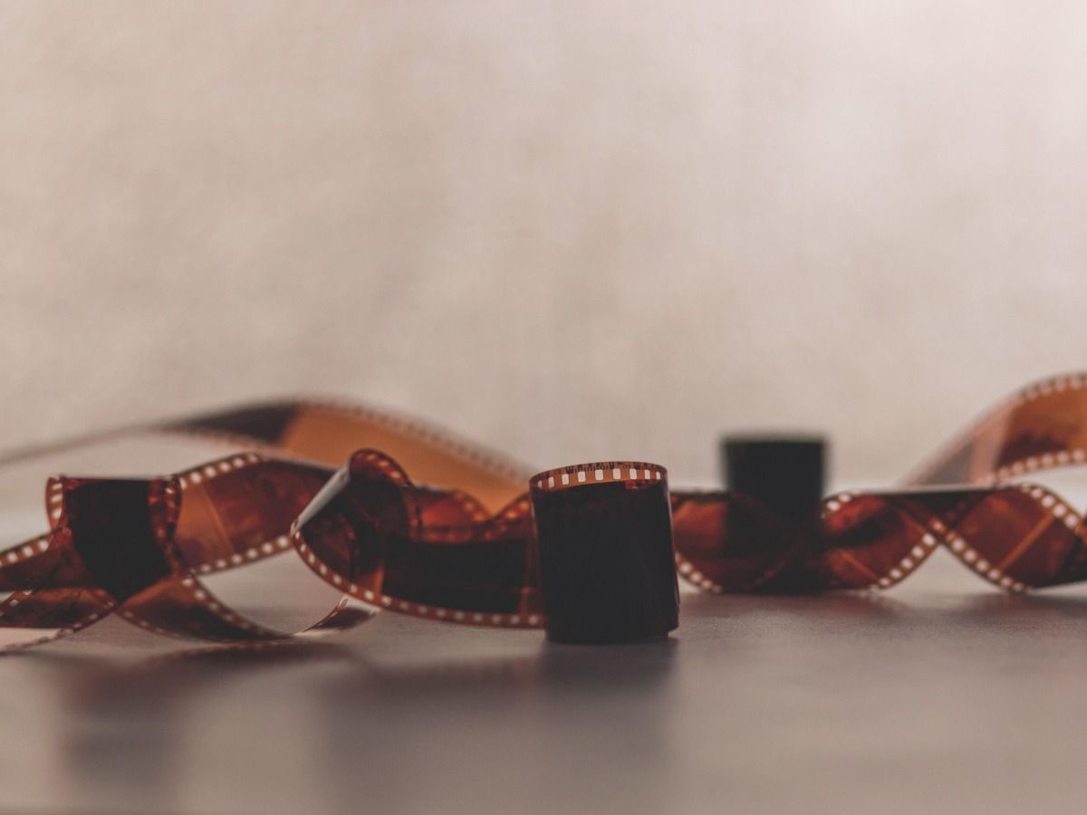 Camera film rolls are lying on the table - Essential video marketing tips for beginners - Image